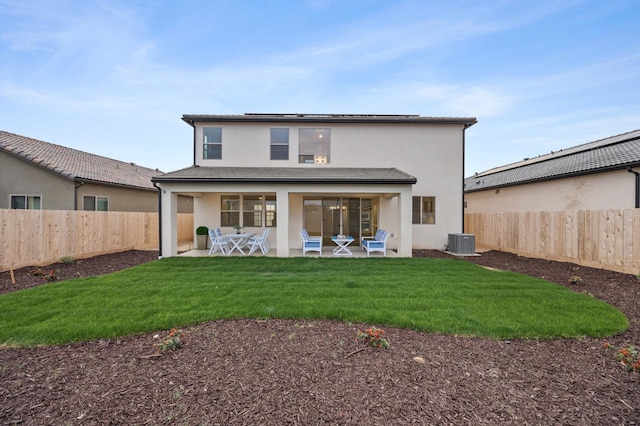 4288 N Phoenix, Fresno, CA 93723 - rear view of house with stucco siding, a fenced backyard, and a patio