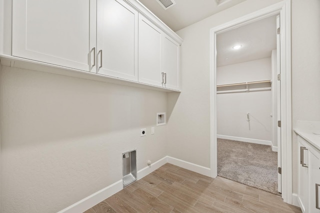 laundry area featuring hookup for an electric dryer, light wood-type flooring, cabinet space, baseboards, and washer hookup