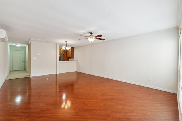 7178 N Fruit Ave Unit 132, Fresno, CA 93711 - unfurnished living room featuring baseboards, ornamental molding, wood finished floors, and ceiling fan with notable chandelier