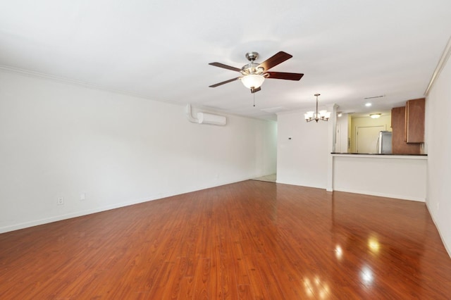 7178 N Fruit Ave Unit 132, Fresno, CA 93711 - unfurnished living room with ornamental molding, wood finished floors, a wall mounted AC, and ceiling fan with notable chandelier