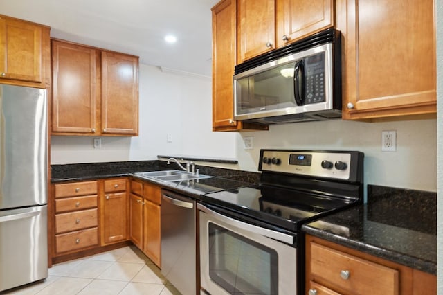7178 N Fruit Ave Unit 132, Fresno, CA 93711 - kitchen with brown cabinetry, appliances with stainless steel finishes, and a sink