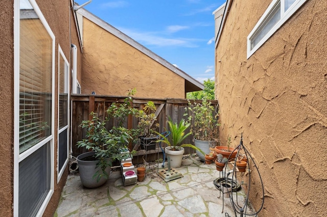 7178 N Fruit Ave Unit 132, Fresno, CA 93711 - exterior space with a fenced backyard, a patio area, and stucco siding