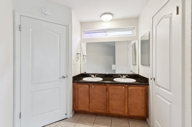 7178 N Fruit Ave Unit 132, Fresno, CA 93711 - bathroom with tile patterned floors, a sink, and double vanity