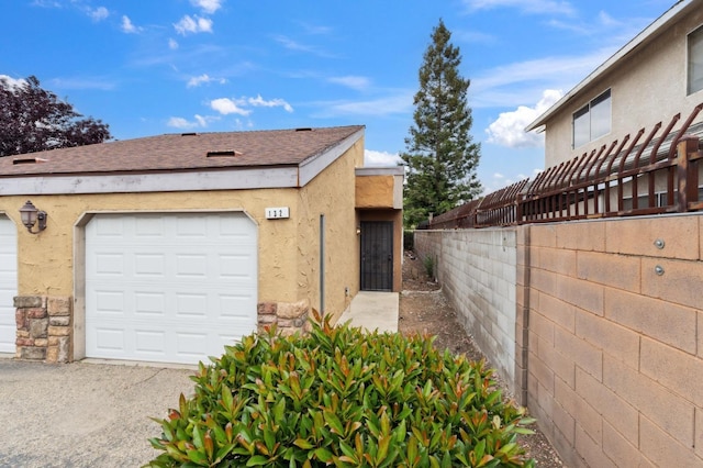 7178 N Fruit Ave Unit 132, Fresno, CA 93711 - view of property exterior with stucco siding and fence