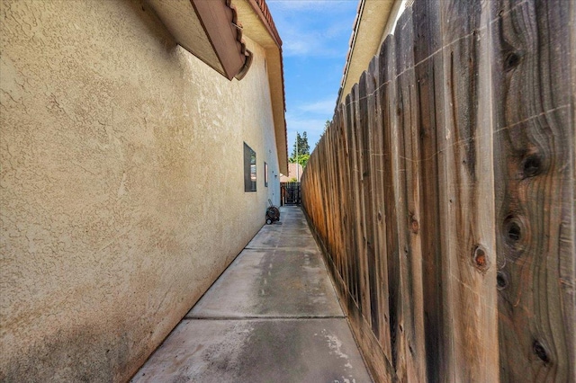 1607 E Everglade Ave, Fresno, CA 93720 - view of property exterior featuring stucco siding and fence