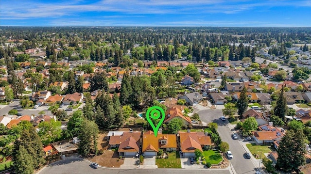 1607 E Everglade Ave, Fresno, CA 93720 - aerial overview of property's location with nearby suburban area and a heavily wooded area