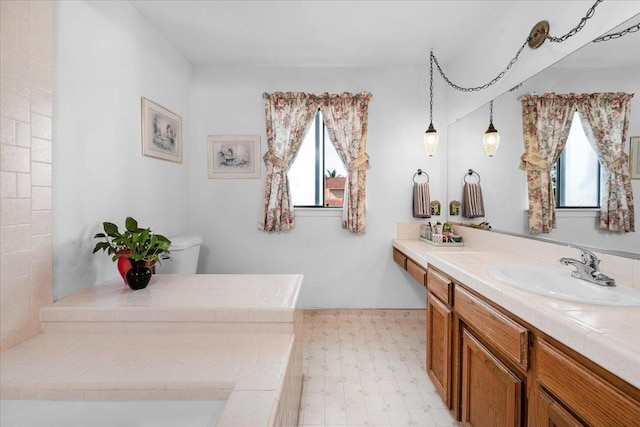1607 E Everglade Ave, Fresno, CA 93720 - full bath with plenty of natural light, vanity, tile patterned floors, and toilet
