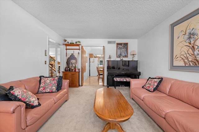 1607 E Everglade Ave, Fresno, CA 93720 - living area with light carpet and a textured ceiling