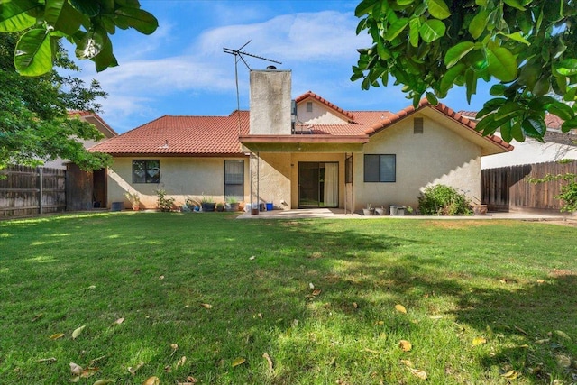 1607 E Everglade Ave, Fresno, CA 93720 - back of house featuring a chimney, stucco siding, a tiled roof, and a patio