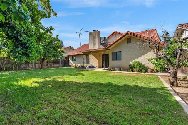 1607 E Everglade Ave, Fresno, CA 93720 - rear view of property with stucco siding, a chimney, and a tile roof