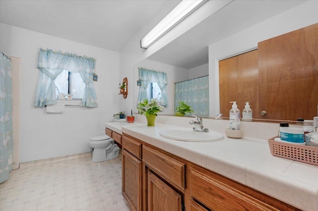 1607 E Everglade Ave, Fresno, CA 93720 - full bath featuring tile patterned floors, toilet, vanity, and a shower with shower curtain