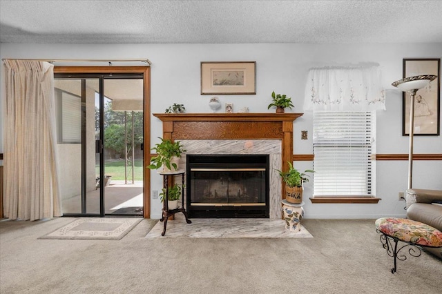 1607 E Everglade Ave, Fresno, CA 93720 - living room featuring carpet floors, a fireplace, and a textured ceiling