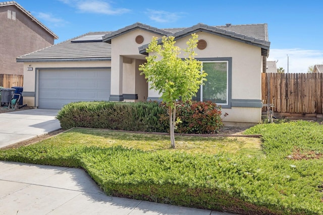 ranch-style home with a garage, concrete driveway, stucco siding, and a tile roof