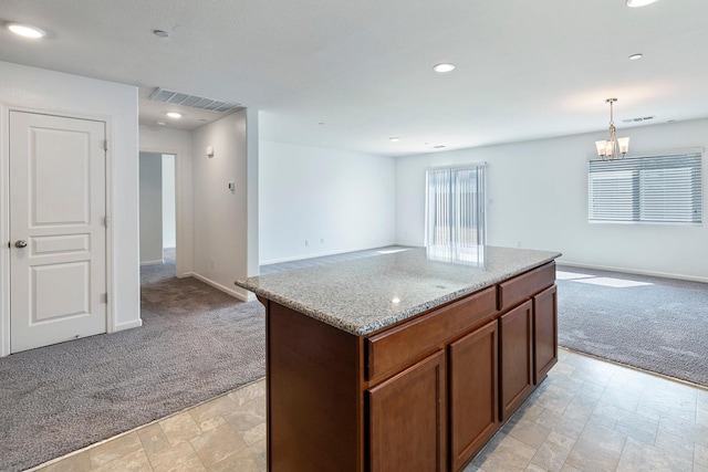 kitchen featuring open floor plan, light carpet, baseboards, and recessed lighting