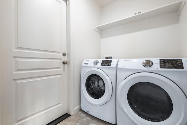 washroom with separate washer and dryer