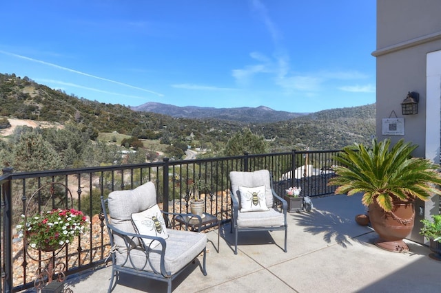 balcony featuring a mountain view