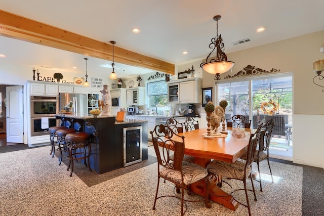 dining space featuring beverage cooler, visible vents, beam ceiling, and recessed lighting