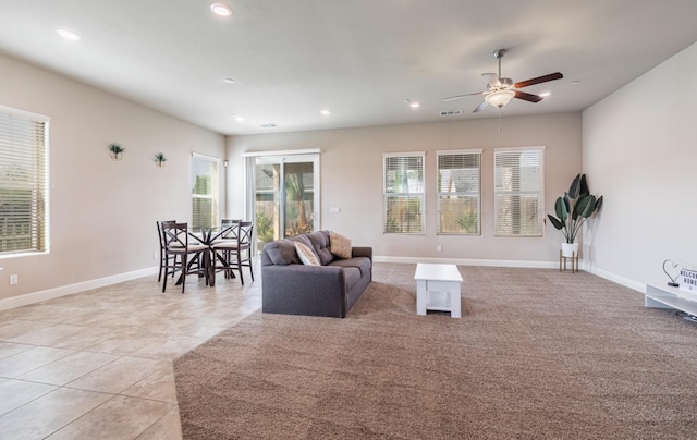 living room with baseboards, a ceiling fan, visible vents, and recessed lighting