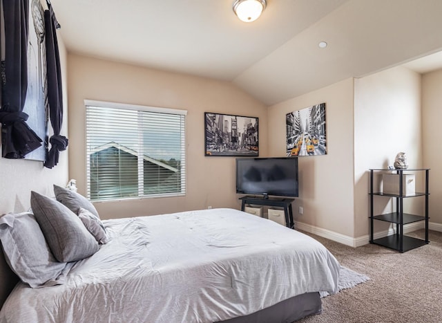 bedroom featuring carpet floors, vaulted ceiling, and baseboards