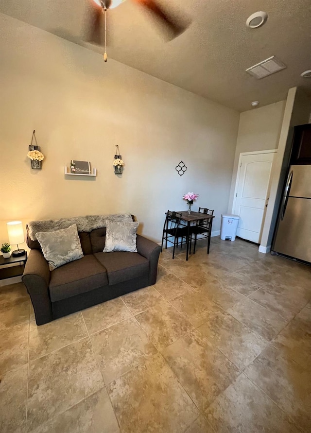 living room featuring a textured ceiling