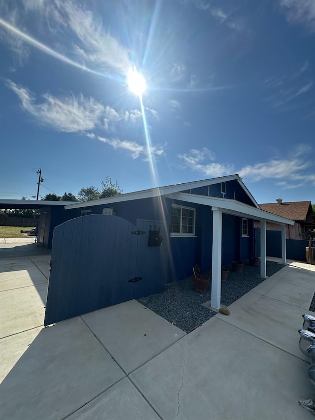 exterior space with driveway and a carport