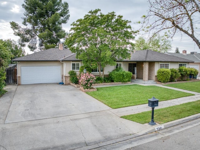 7341 N Bond St, Fresno, CA 93720 - ranch-style house featuring a garage, brick siding, a front yard, and concrete driveway