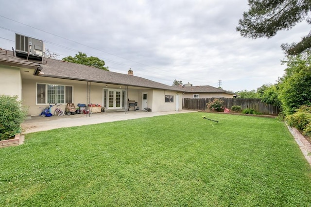 7341 N Bond St, Fresno, CA 93720 - rear view of property featuring french doors, fence, a patio area, a yard, and stucco siding