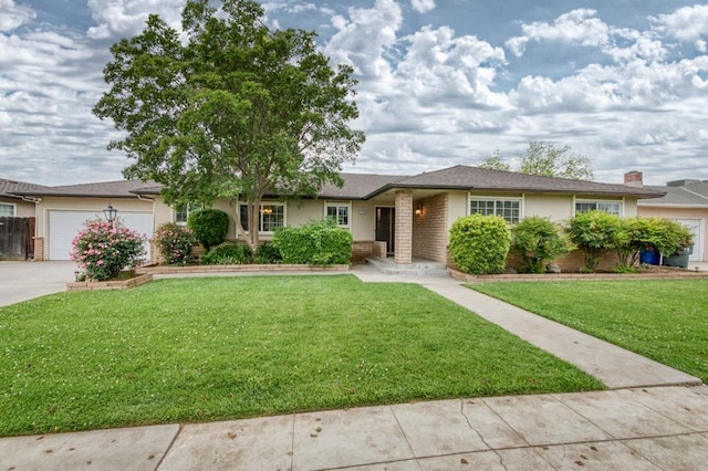7341 N Bond St, Fresno, CA 93720 - ranch-style house with stucco siding, an attached garage, concrete driveway, and a front yard