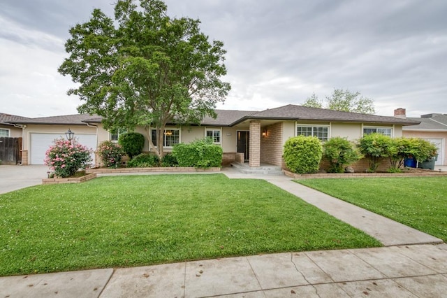 7341 N Bond St, Fresno, CA 93720 - ranch-style house featuring stucco siding, an attached garage, concrete driveway, and a front yard
