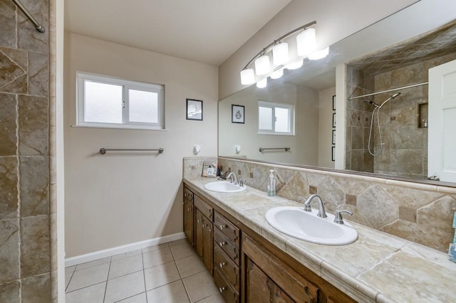 7341 N Bond St, Fresno, CA 93720 - full bathroom with tile patterned floors, baseboards, a sink, and tiled shower