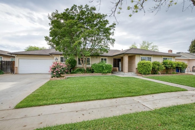 7341 N Bond St, Fresno, CA 93720 - single story home with an attached garage, a front lawn, brick siding, and concrete driveway