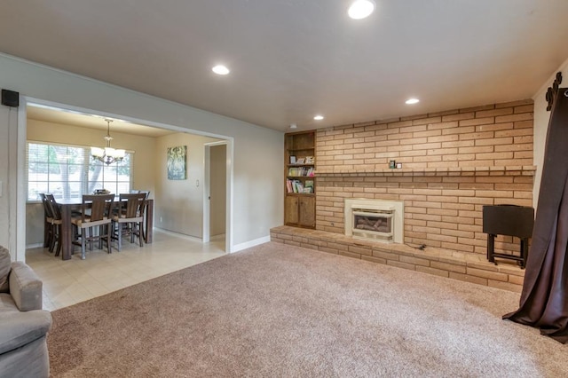 7341 N Bond St, Fresno, CA 93720 - living room with recessed lighting, an inviting chandelier, light carpet, and baseboards