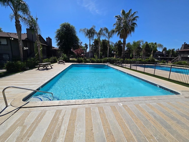 1151 S Chestnut Ave Unit 146, Fresno, CA 93702 - community pool featuring a patio area and fence