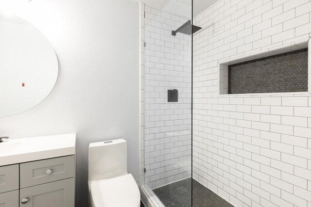 1151 S Chestnut Ave Unit 146, Fresno, CA 93702 - bathroom with vanity, toilet, and a tile shower