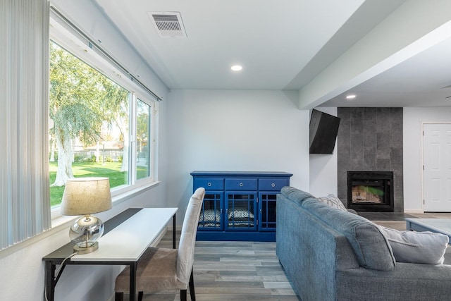 1151 S Chestnut Ave Unit 146, Fresno, CA 93702 - living area featuring recessed lighting, a tiled fireplace, visible vents, and wood finished floors