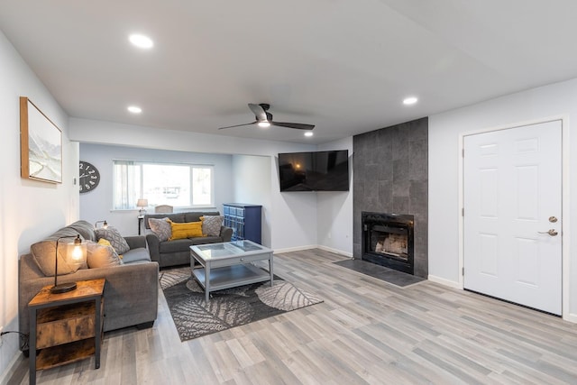 1151 S Chestnut Ave Unit 146, Fresno, CA 93702 - living room with a ceiling fan, light wood-style floors, a tiled fireplace, and recessed lighting