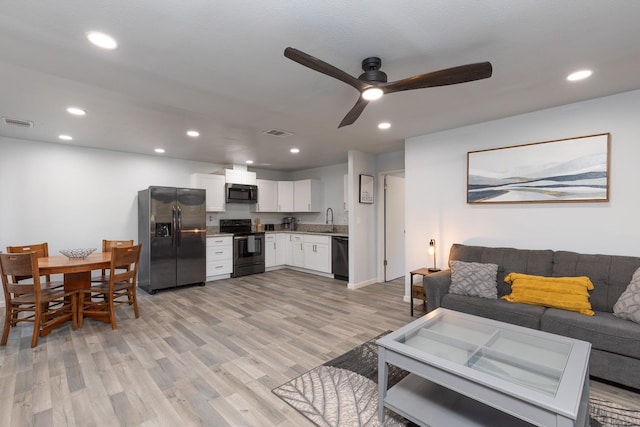 1151 S Chestnut Ave Unit 146, Fresno, CA 93702 - living room with light wood finished floors, visible vents, a ceiling fan, and recessed lighting
