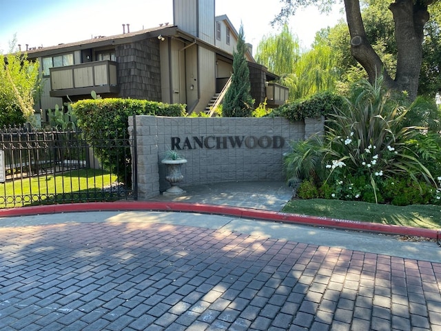 view of gate with fence
