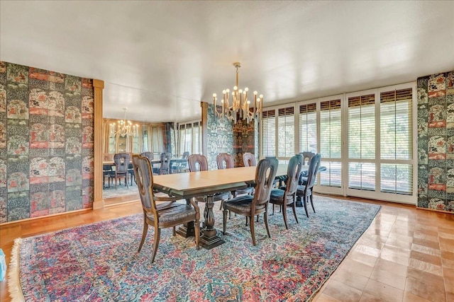 dining area featuring a notable chandelier