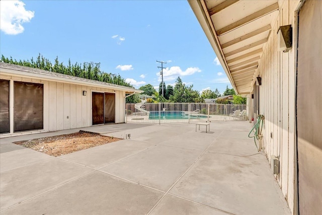 view of patio / terrace featuring a fenced in pool and fence