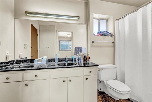 full bathroom featuring vanity and toilet