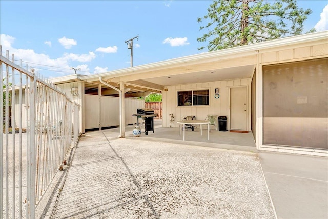 view of patio / terrace featuring grilling area and fence