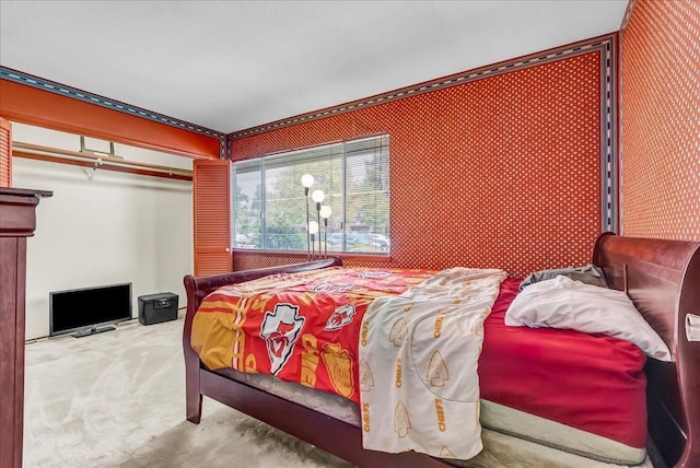 carpeted bedroom with a closet