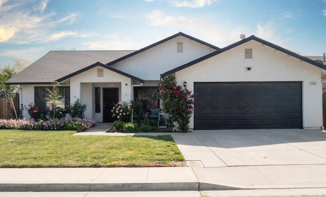 ranch-style house featuring stucco siding, concrete driveway, a front yard, and a garage