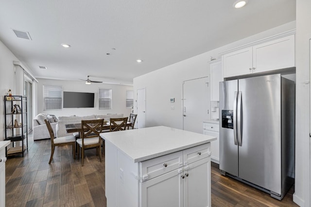6082 E Homan Ave, Fresno, CA 93727 - kitchen featuring stainless steel refrigerator with ice dispenser, light countertops, a kitchen island, white cabinetry, and dark wood-style flooring