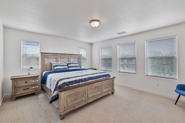 6082 E Homan Ave, Fresno, CA 93727 - bedroom with light colored carpet and a textured ceiling