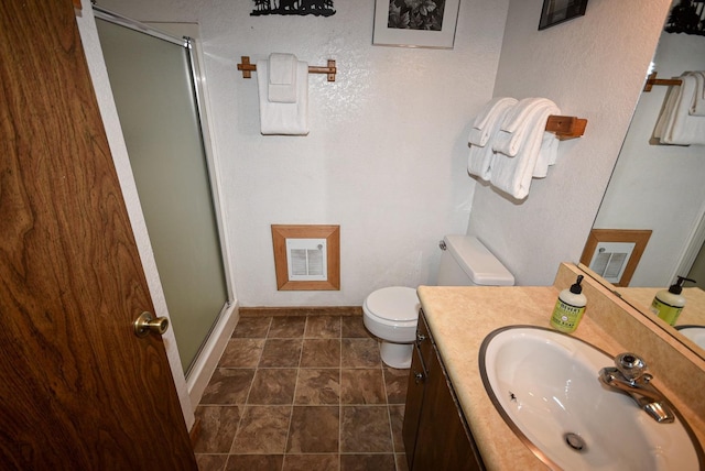 40720 Oakwoods Ln, Shaver Lake, CA 93664 - bathroom with baseboards, toilet, visible vents, a shower stall, and vanity