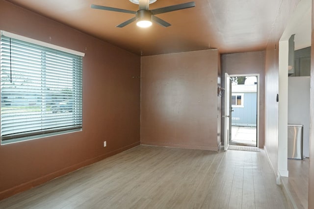 1016 N White St, Hanford, CA 93230 - unfurnished room featuring baseboards, a ceiling fan, and wood finished floors