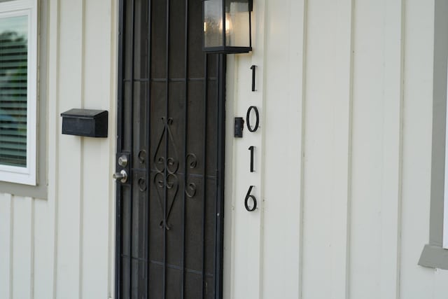 1016 N White St, Hanford, CA 93230 - doorway to property with board and batten siding