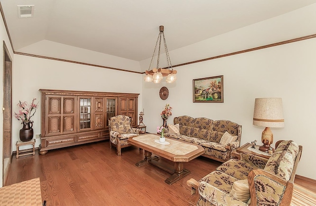 7355 N Pacific Ave, Fresno, CA 93711 - living area featuring vaulted ceiling, dark wood-style flooring, and visible vents
